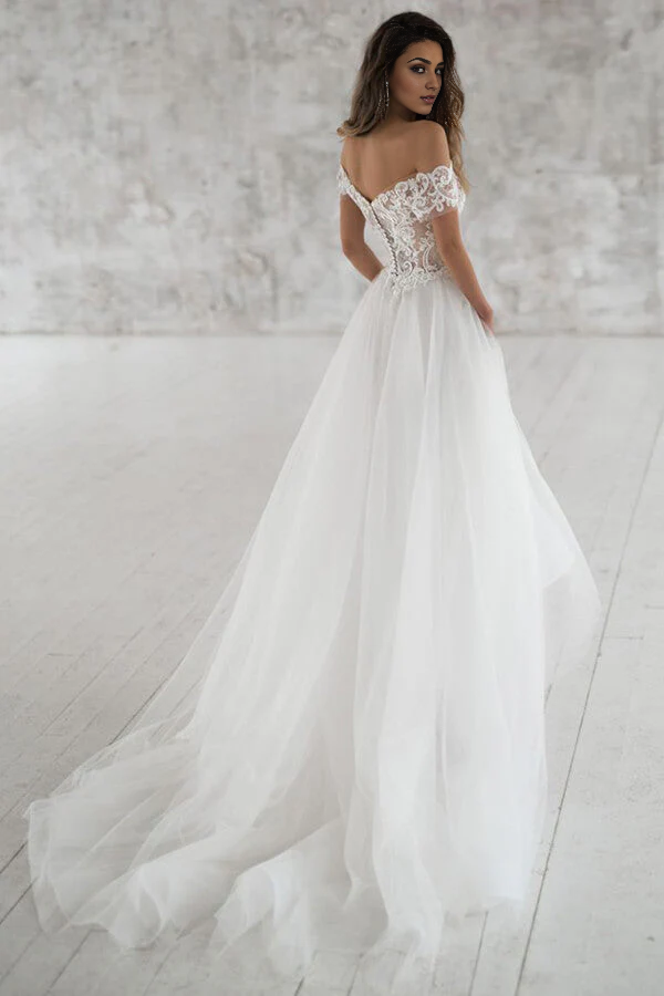 Back view of the A-line wedding dress showing flowing tulle skirt.