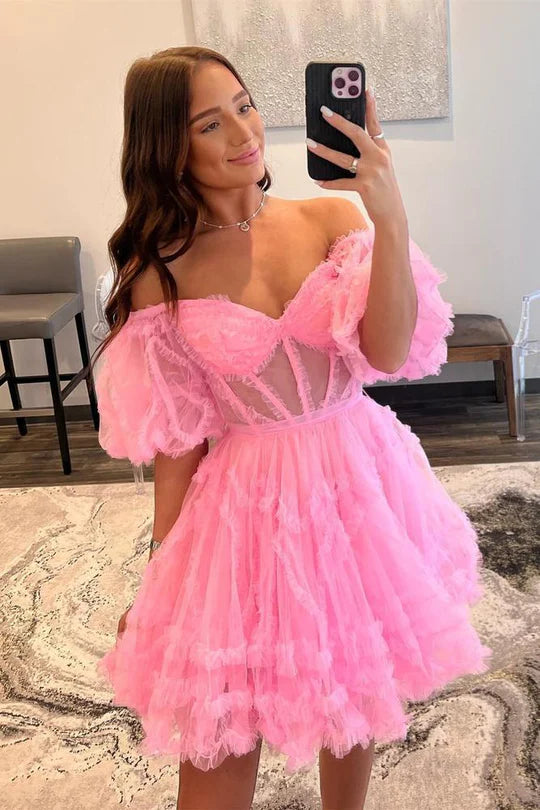 Women's A-line off-the-shoulder dress with tulle ruffles, side view.