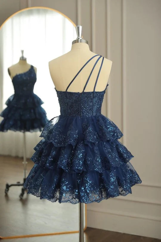 A-line one-shoulder homecoming dress featuring appliques and multi-layer tulle.