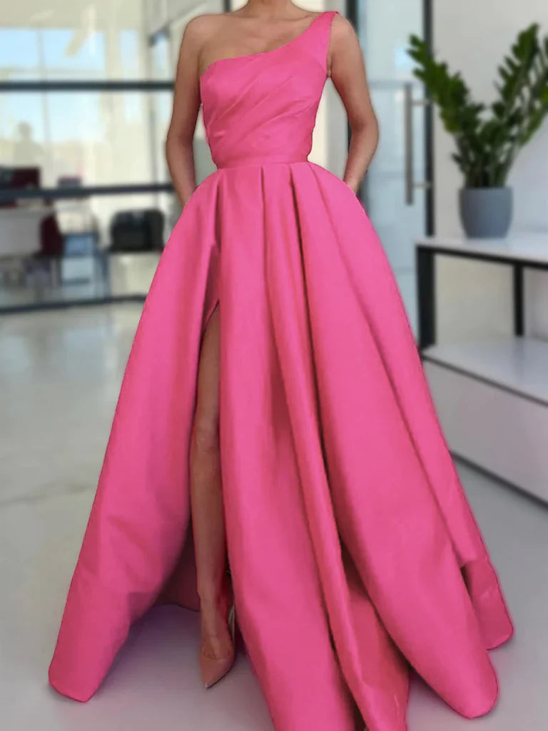 Woman wearing an elegant A-line one-shoulder satin long prom dress with a high slit.