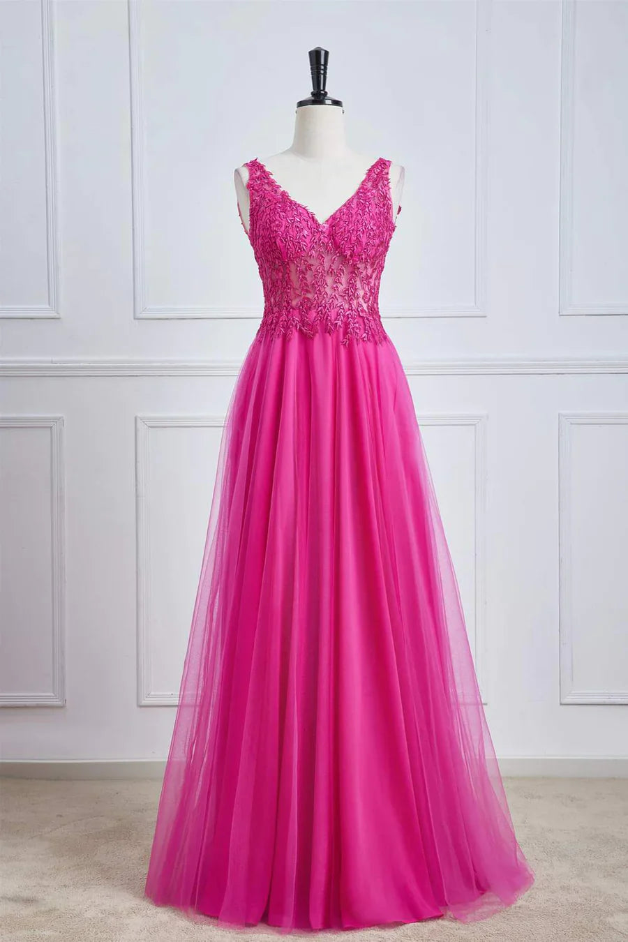 Fuchsia A-line long prom dress with plunging V-neck and floral details.