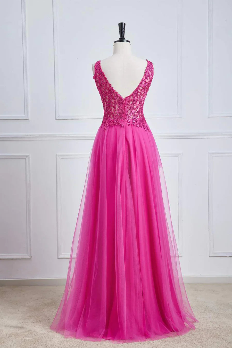 Back view of fuchsia A-line long prom dress.