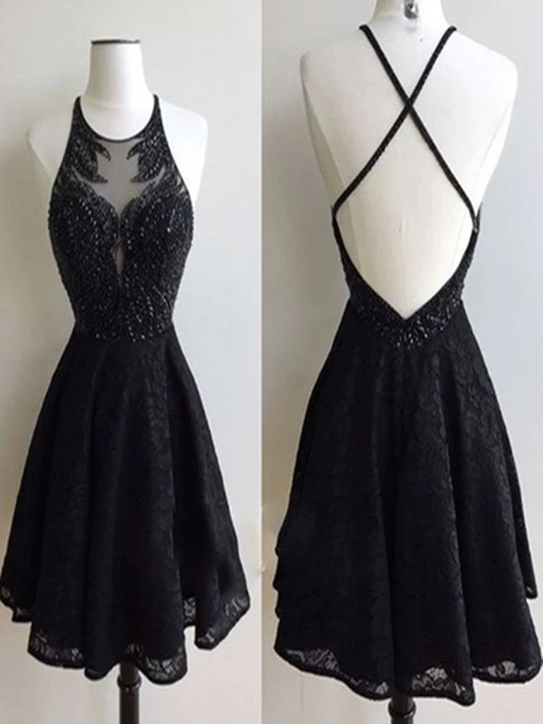 Woman wearing a short A-line lace prom dress with a round neck and backless design.