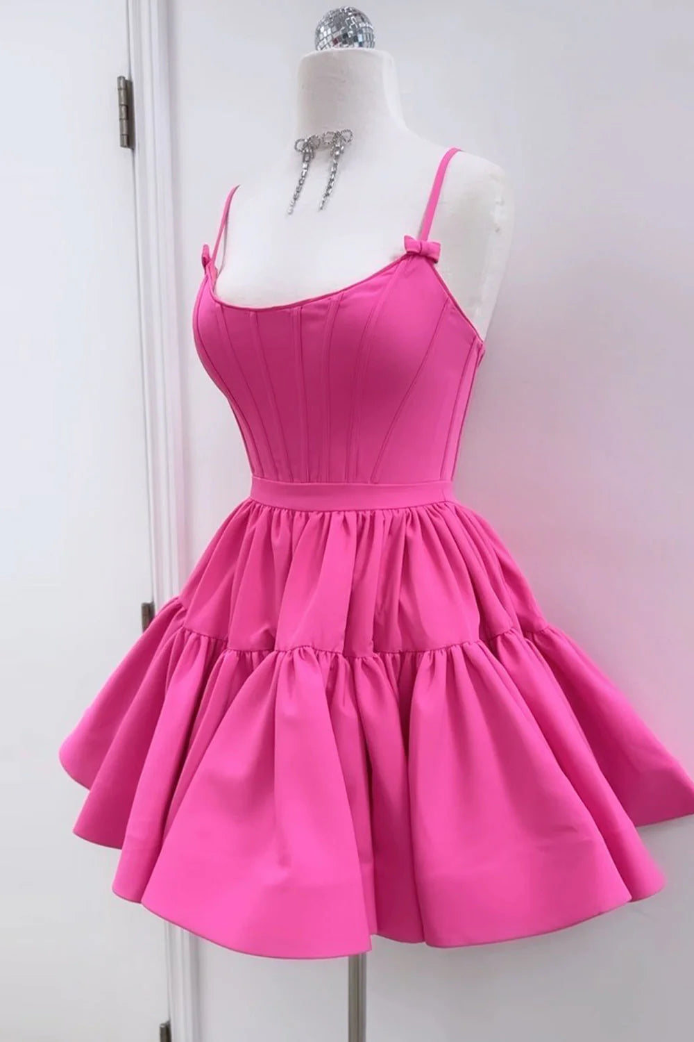 Model wearing the elegant ruffled short dress with V-neck.