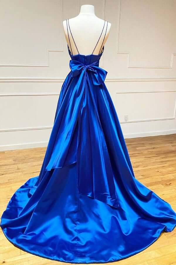 Back view of a royal blue A-line satin prom dress.