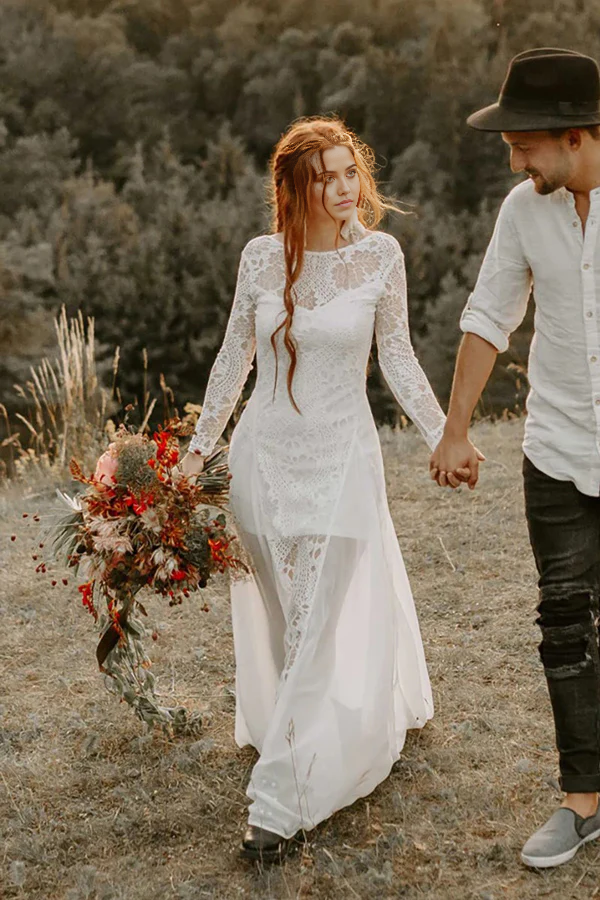 Close-up of the scoop neck and long sleeve detail on a wedding dress.