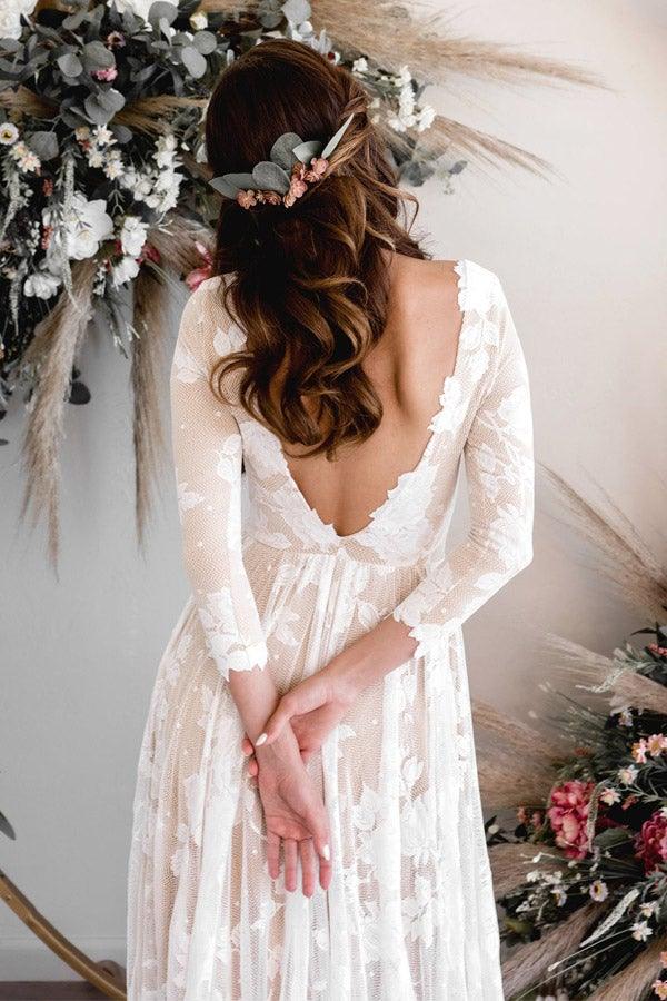 Back view of an A-line lace wedding dress with long sleeves.