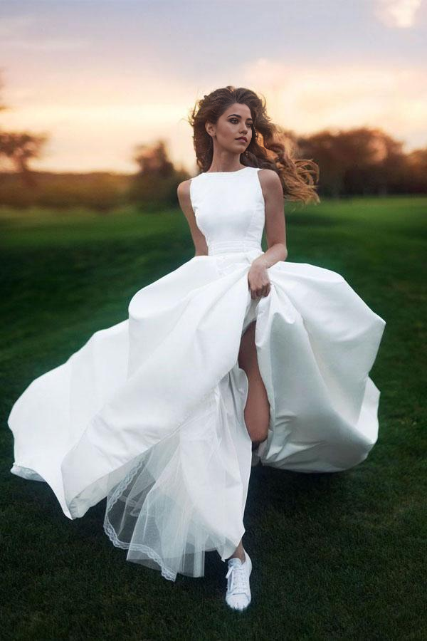Elegant A-line satin wedding dress with a scoop neck and long train.