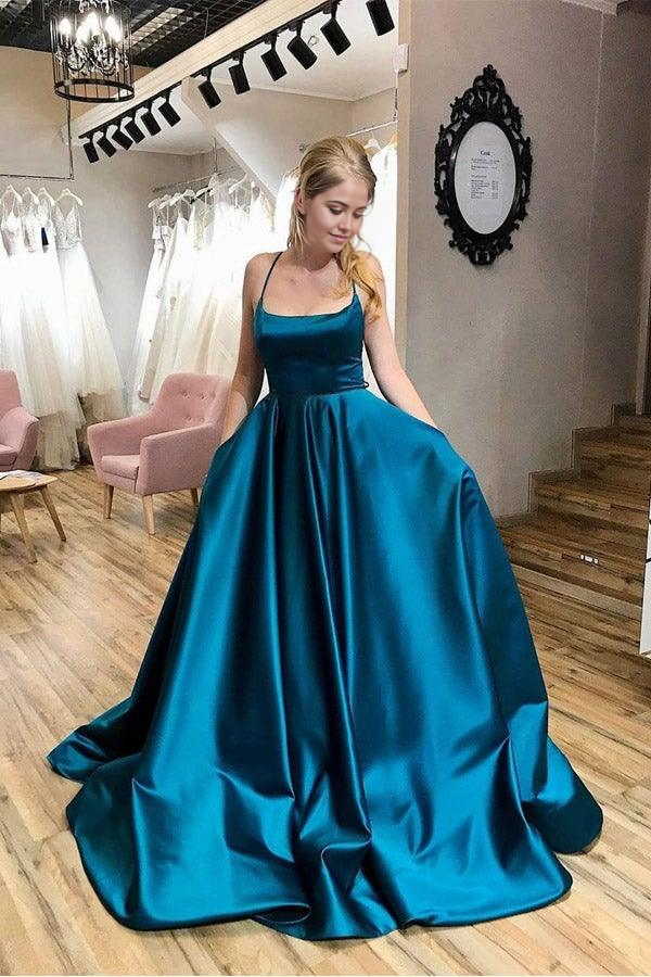 Elegant A-line prom dress with scoop neck and cross straps.