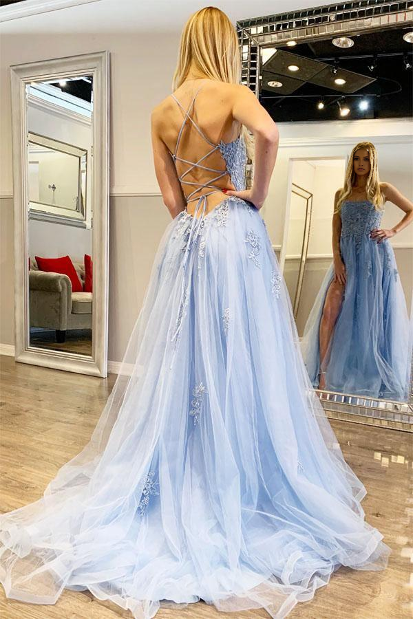 Elegant long evening gown featuring a sweep train and delicate spaghetti straps.