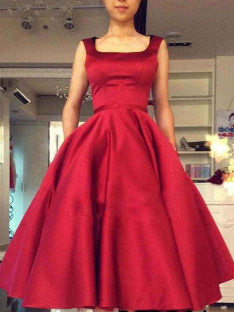 Front view of a short A-line satin dress with a square neckline.
