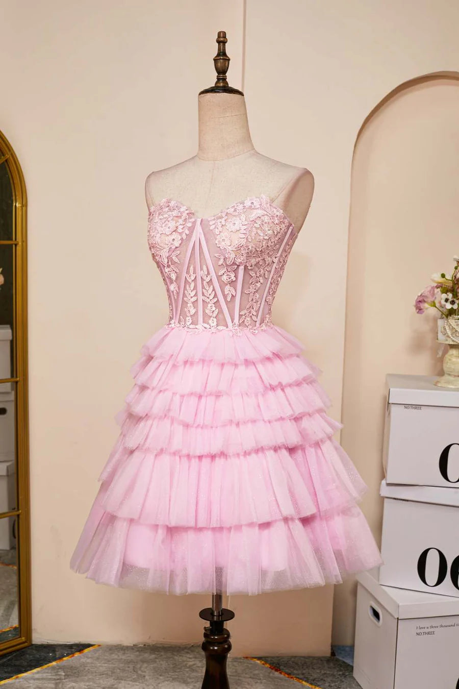 Back view of the strapless multi-layer short dress.