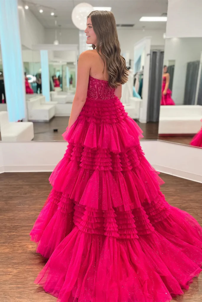Full view of the long A-line strapless prom dress with intricate appliques.