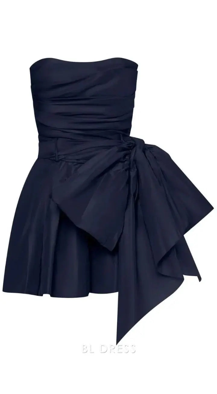 A woman wearing an elegant A-line strapless long formal dress.