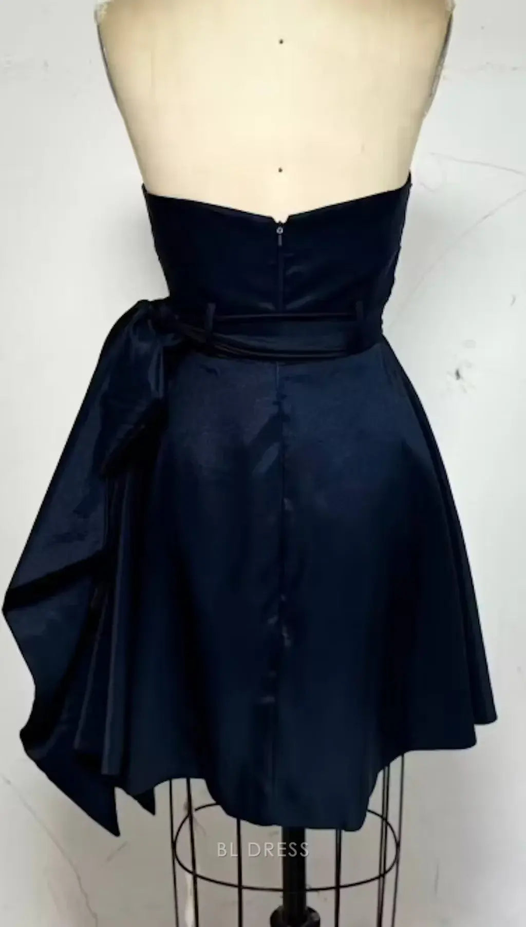 Full view of an A-line strapless gown, showcasing its flowing silhouette.