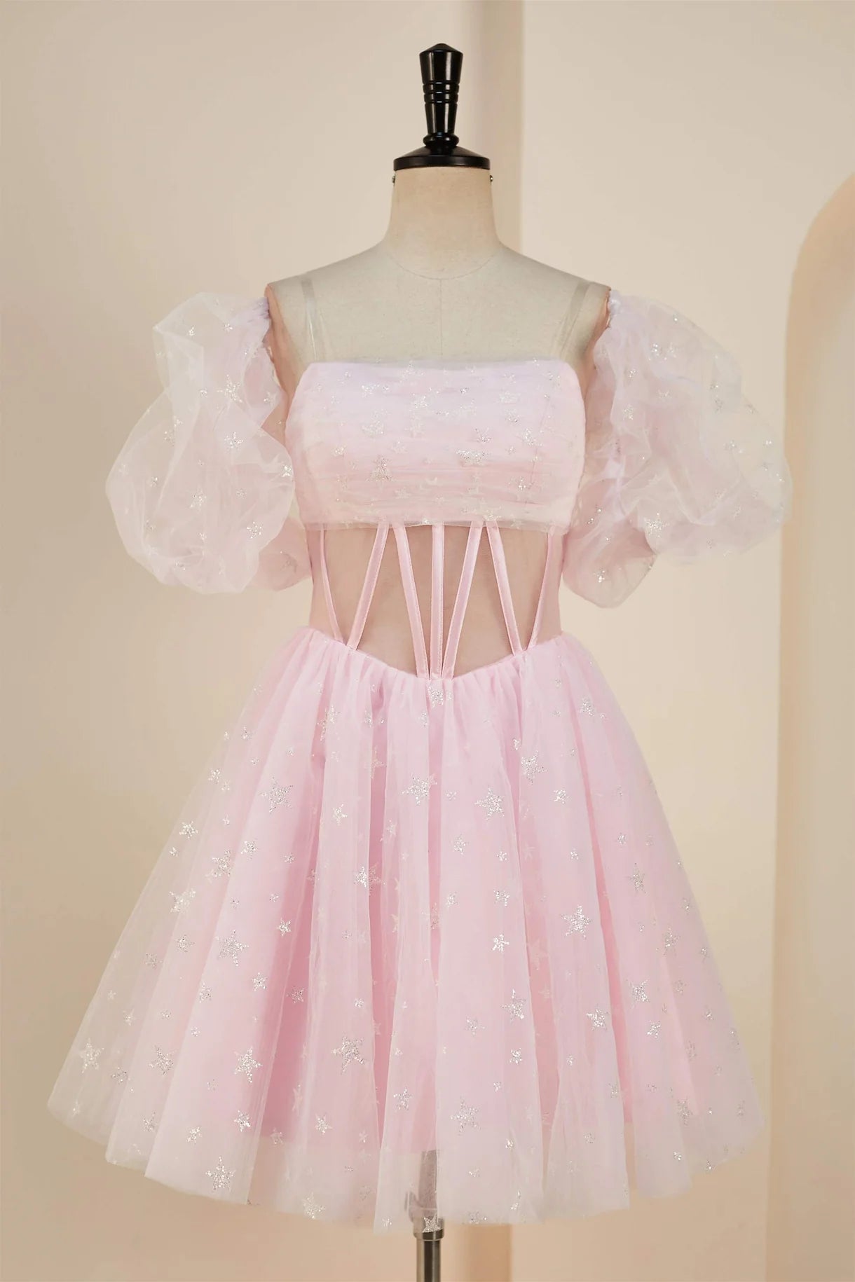 Model wearing an elegant A-line strapless homecoming dress.