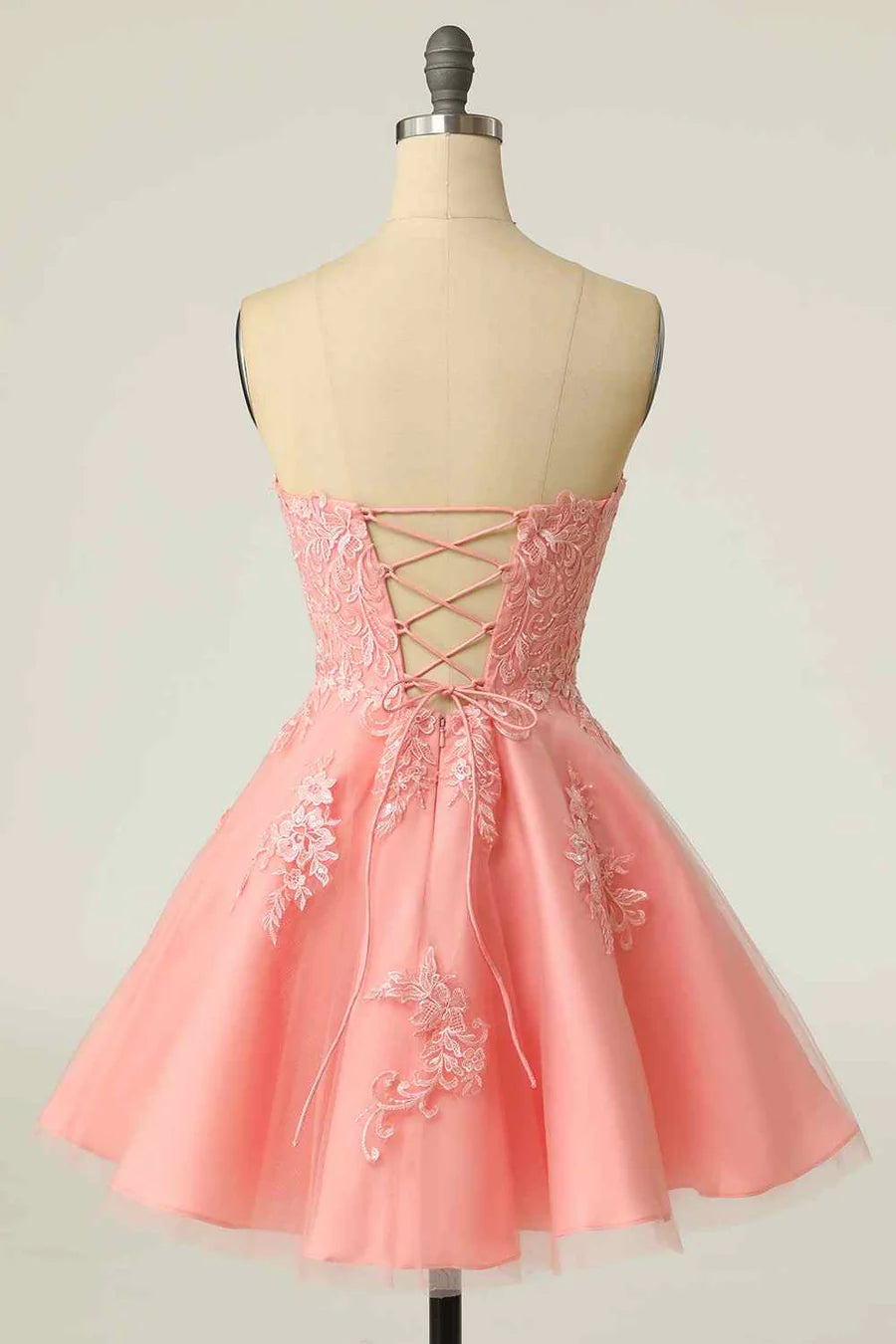 Back view of A-line homecoming dress with lace-up closure.