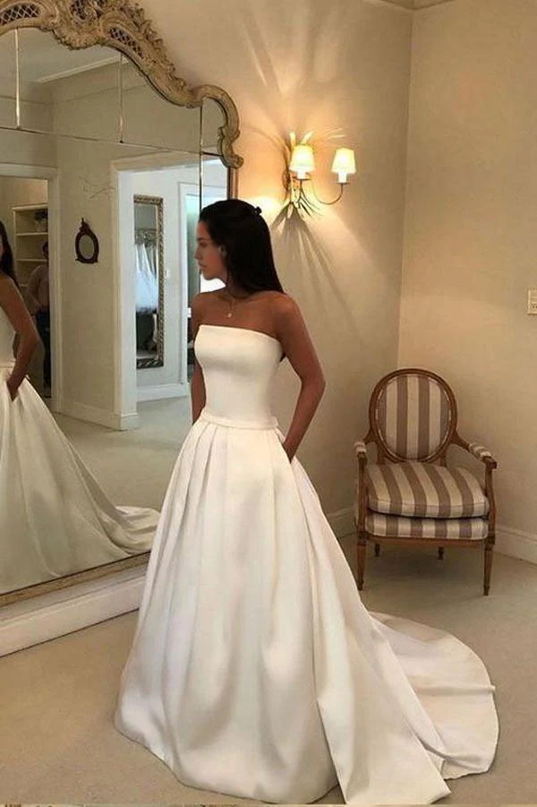 Back view of ivory A-line strapless satin wedding dress, showing open back detail.