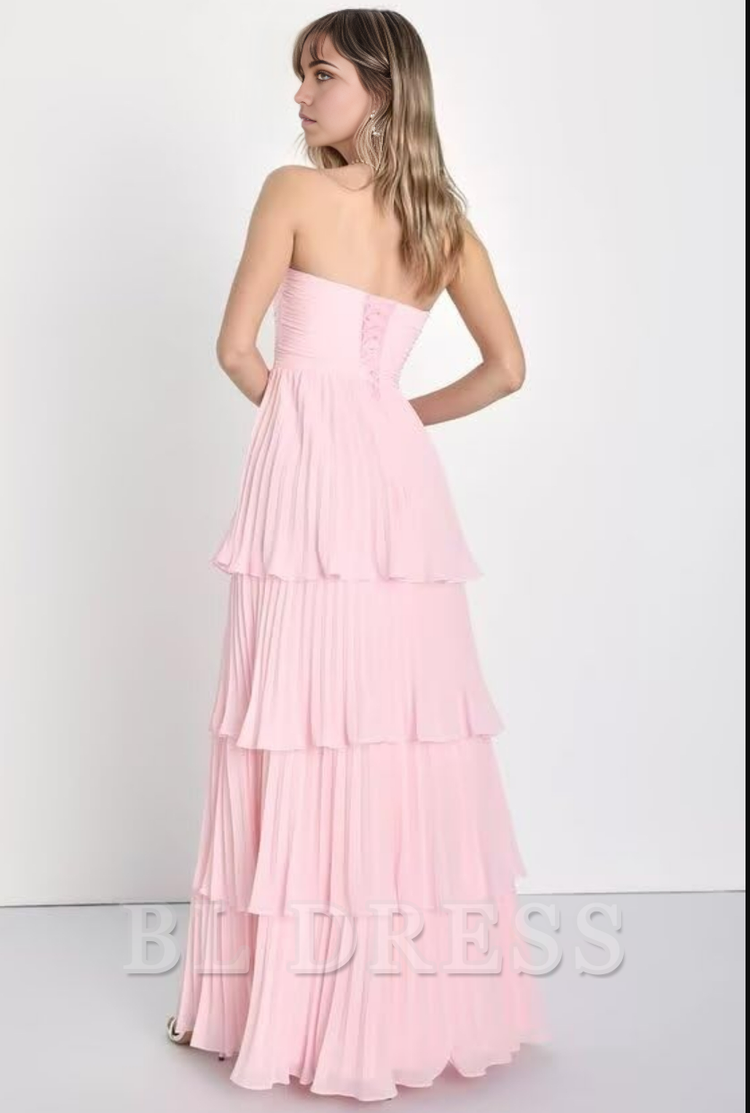 Close-up of the ruffle tiered detail on the chiffon formal gown.