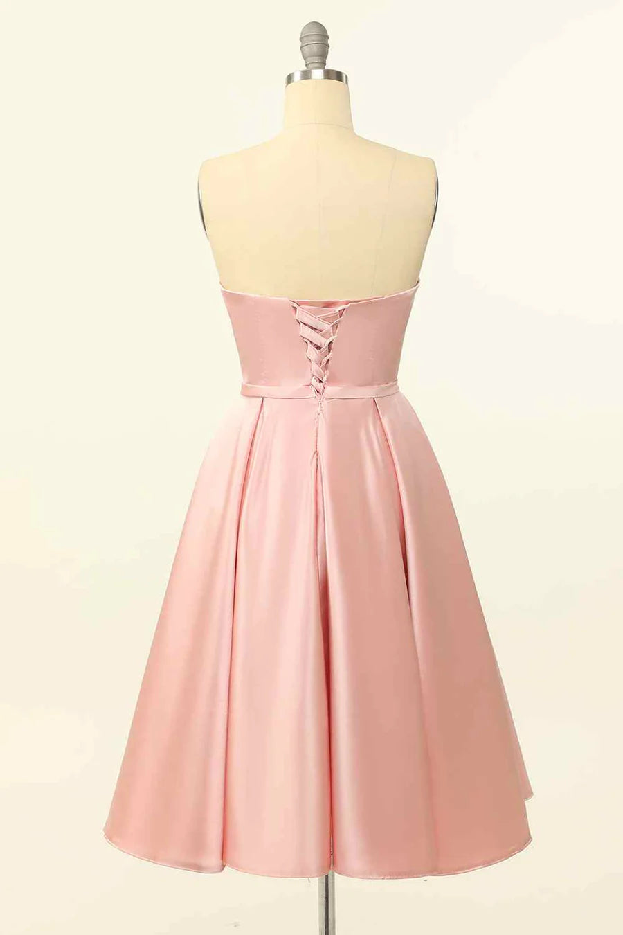 Back view of the A-line strapless satin mini dress showing the lace-up detail.