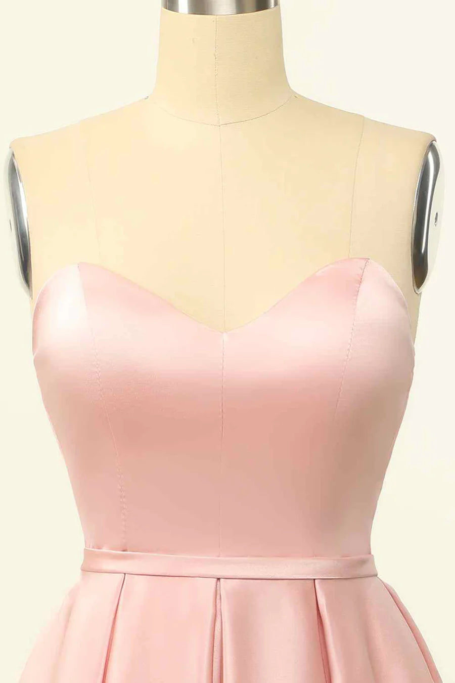 Close-up of the satin fabric and lace-up back on the mini dress.