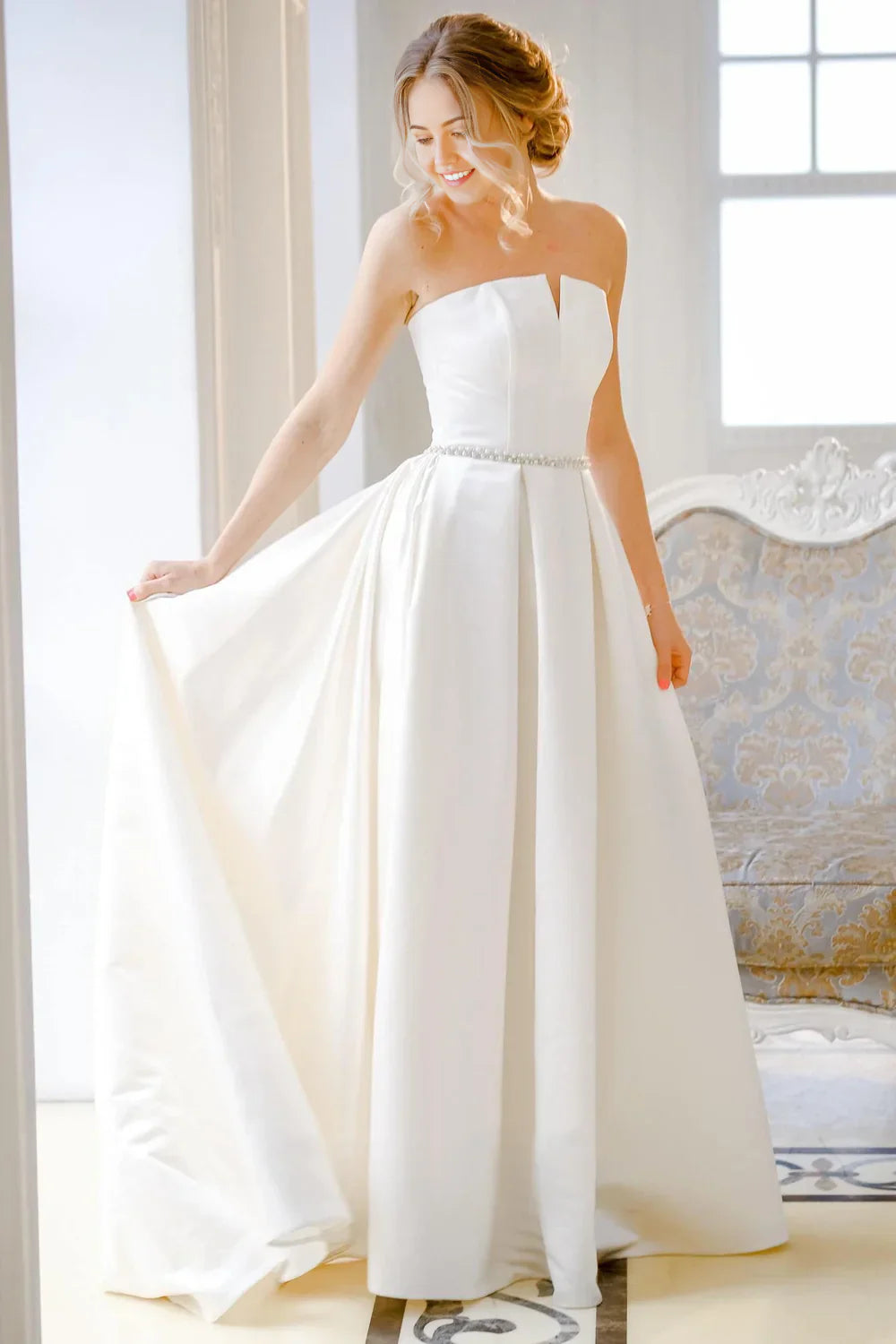 Elegant A-line strapless satin lace wedding dress with a corset back.