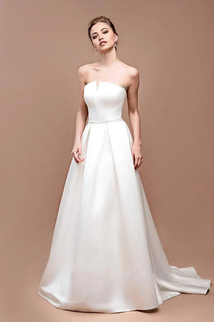 Back view of an A-line wedding dress showcasing the lace-up corset detail.