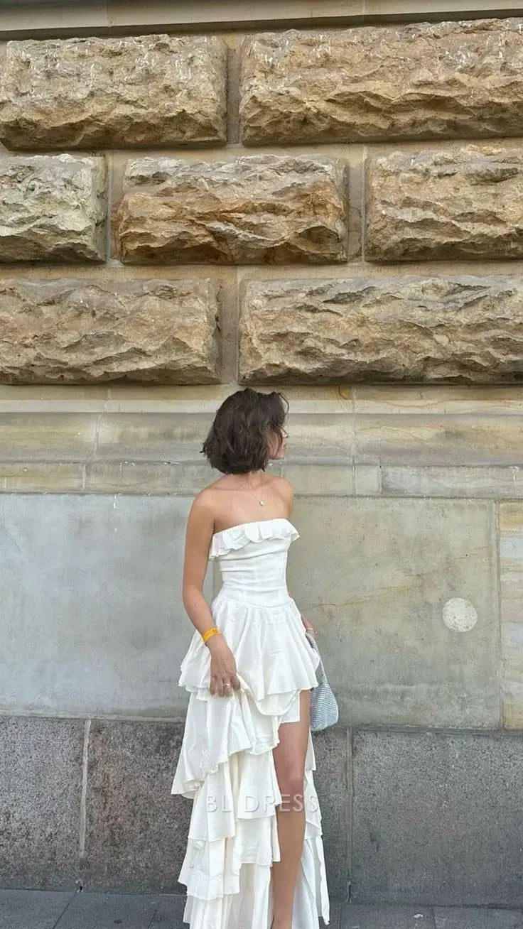 Full-length view of the A-line strapless satin evening gown with a flowing skirt.