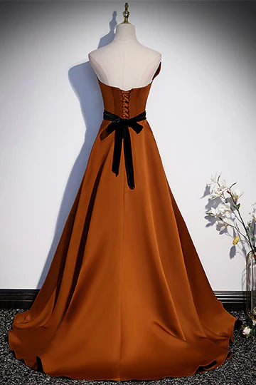 Back view of strapless satin gown showing lace-up detail.