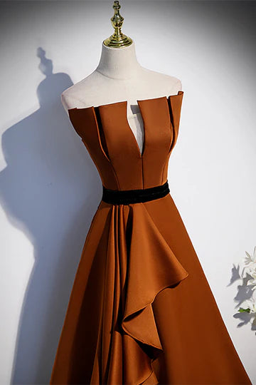 Full length front view of elegant strapless formal dress.