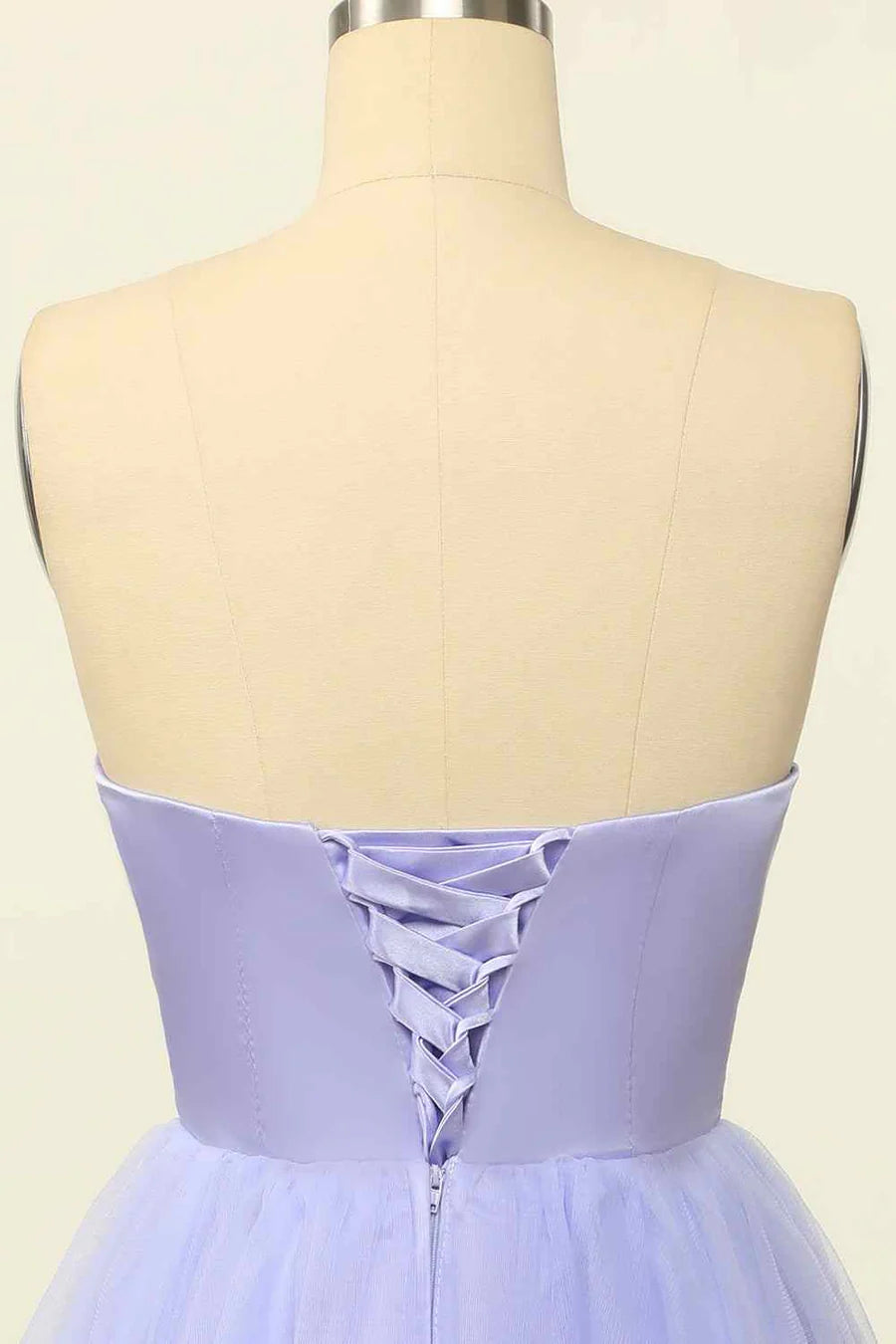 Model wearing A-line mini homecoming dress, front view.
