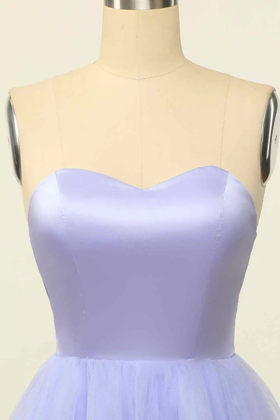 Back view of strapless mini dress with elegant lace-up closure.