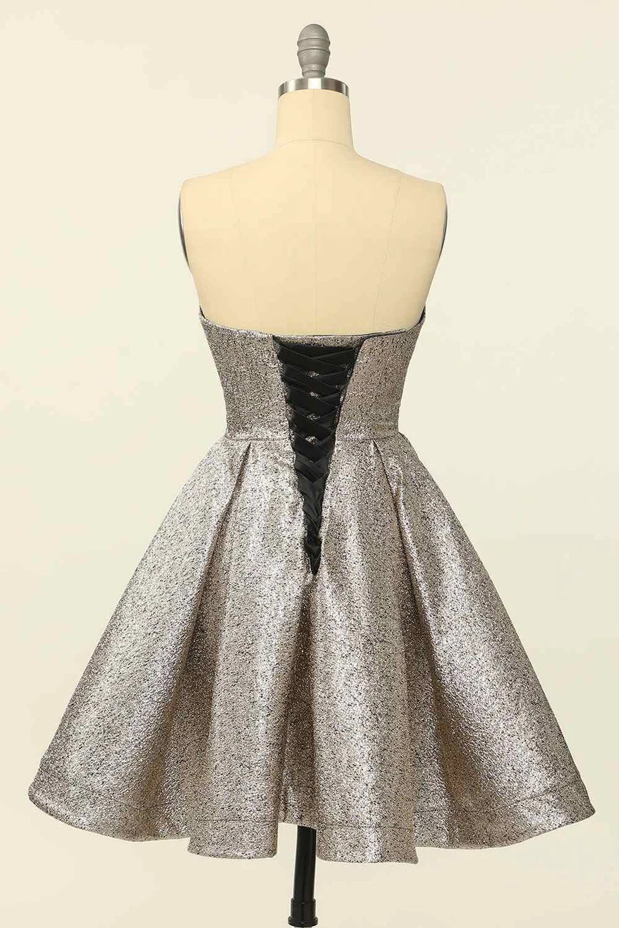 Side profile of A-line mini homecoming dress.