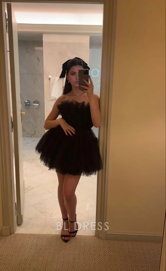 Black A-line strapless tulle dress for formal events.
