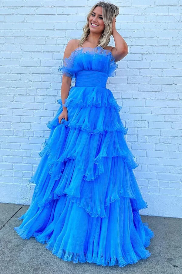 Full length view of a blue A-line strapless prom dress with elegant ruffles.