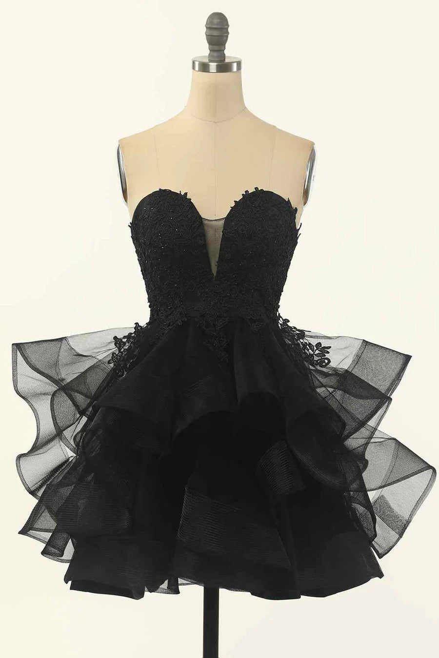 A-line strapless V-neck homecoming dress with applique and multi-layer skirt.