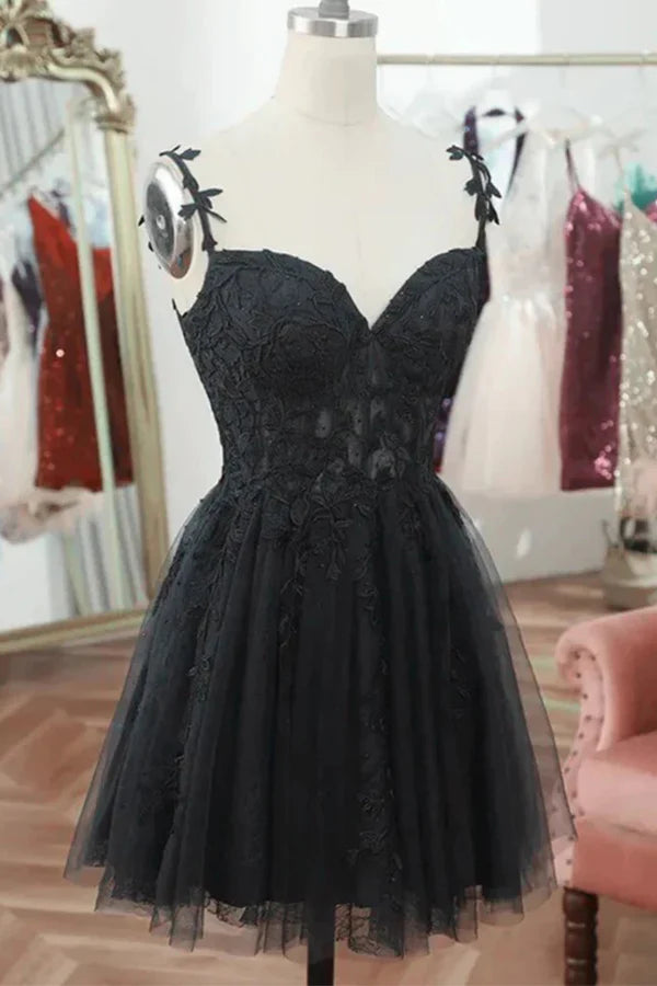 Black A-line homecoming dress with sweetheart neckline and lace details.