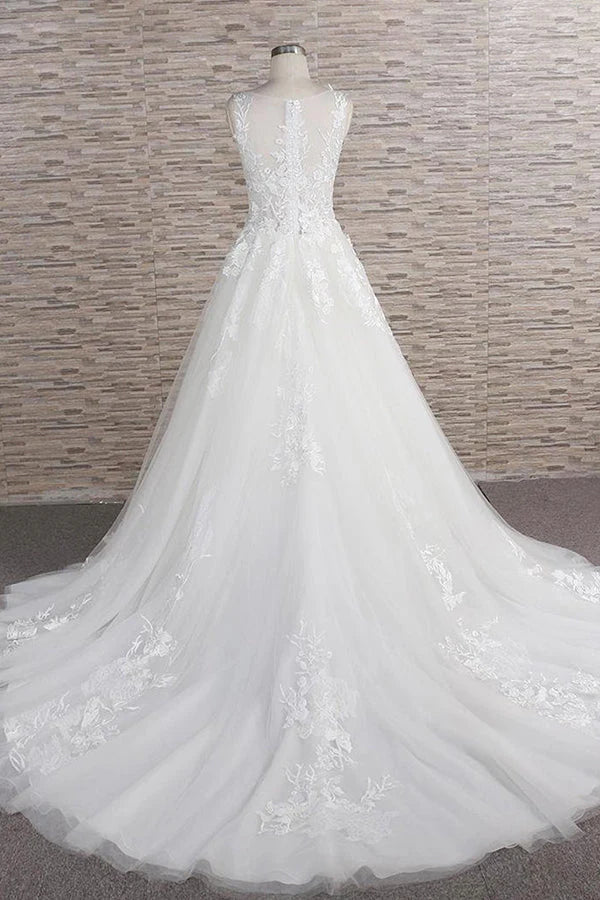 Back view of the long A-line wedding gown with delicate lace details.