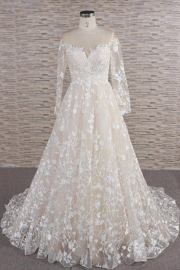 Elegant A-line wedding dress with sweetheart neckline and appliques.