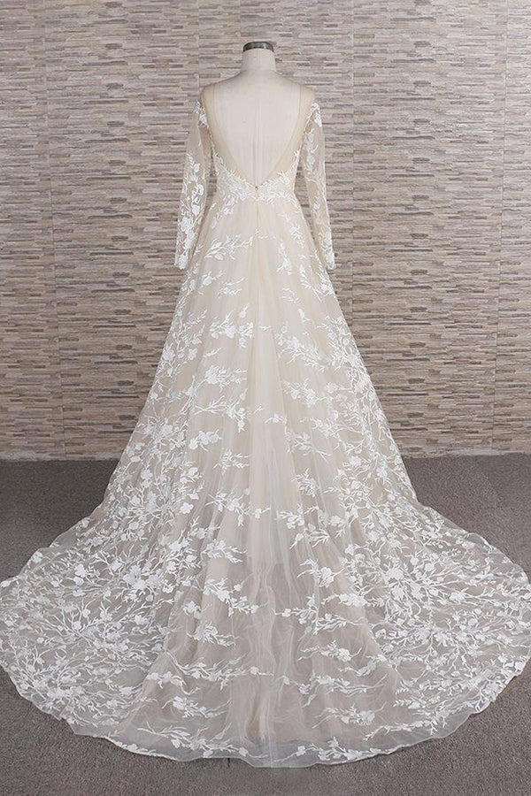 Back view of A-line tulle wedding gown with long sleeves.