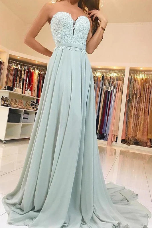 Elegant prom dress with sweetheart lace bodice and flowing chiffon sweep train.