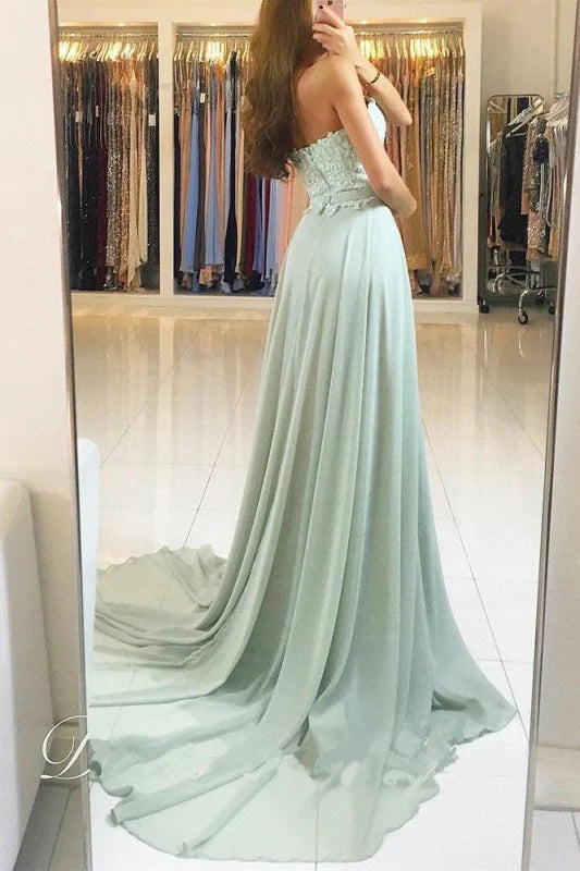 Back view of the elegant backless prom dress with delicate lace and chiffon.
