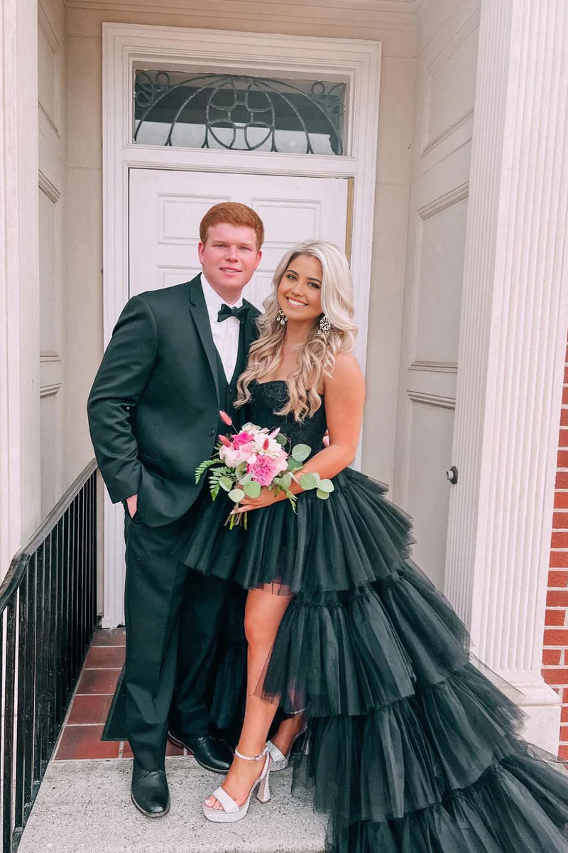Back view of the black A-line high-low prom dress, showcasing the flowing tulle skirt.