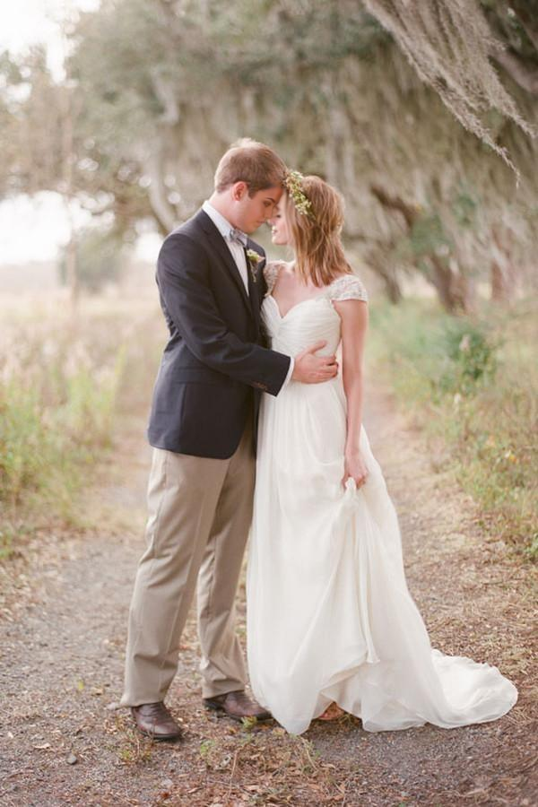 Elegant A-line sweetheart cap sleeve chiffon wedding dress, front view.