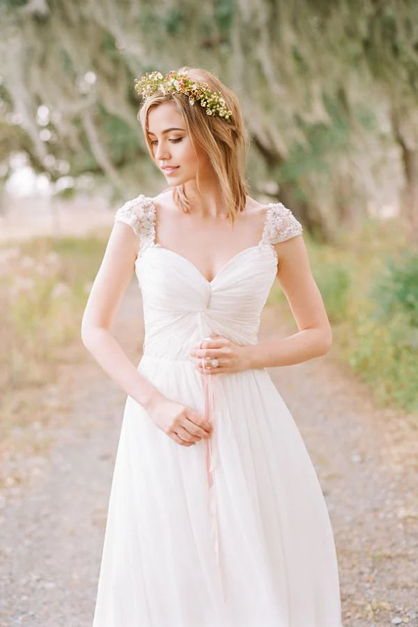 Long A-line sweetheart cap sleeve chiffon wedding dress, back view.