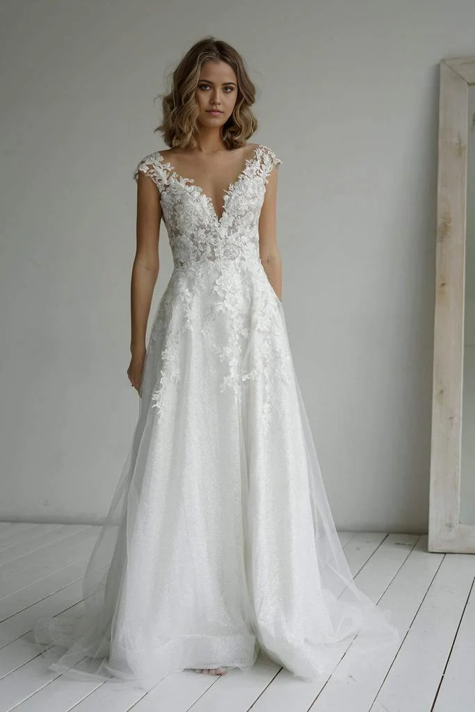 Elegant A-line sweetheart wedding dress with glitter fabric and appliques.