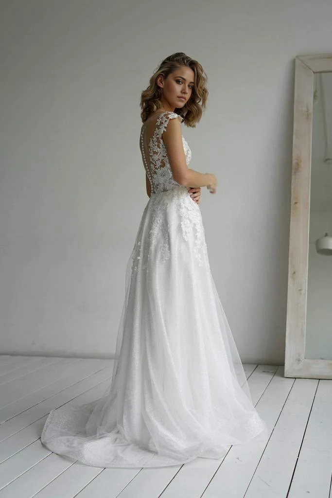 Back view of the A-line sweetheart bridal dress with delicate appliques.