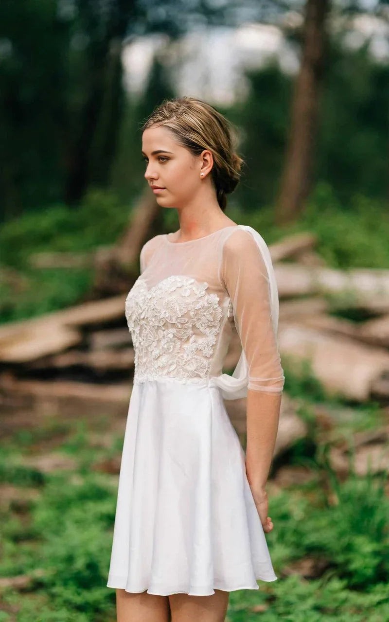 Back view of the flowing A-line wedding dress, showcasing its elegant silhouette and train.