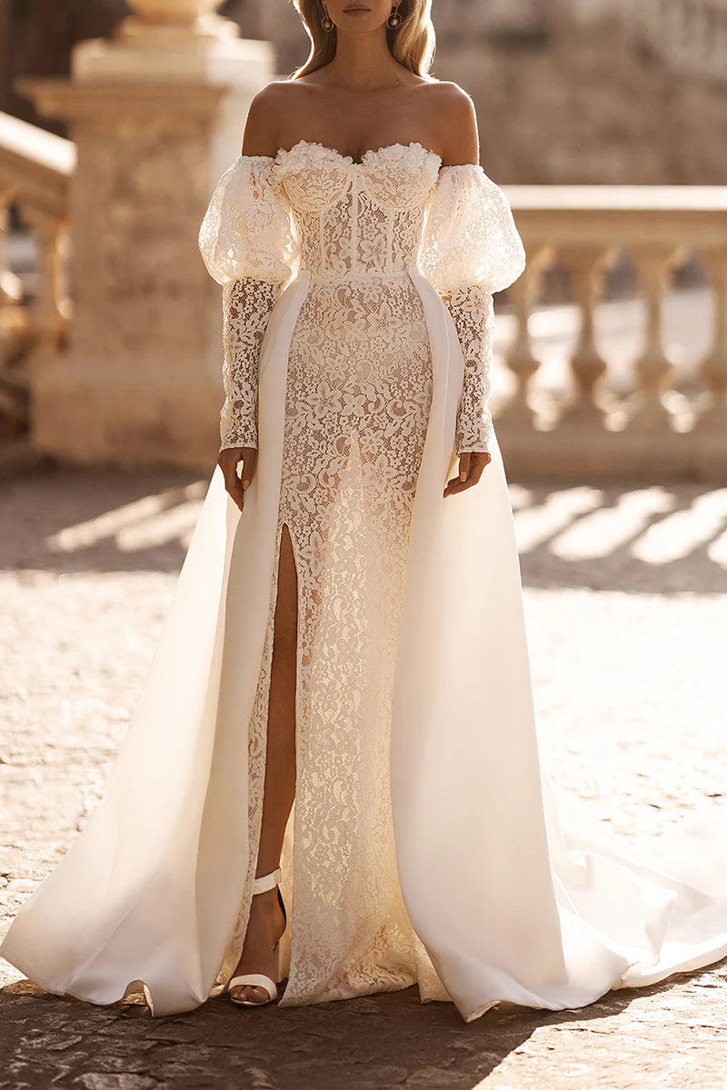 Bride wearing a sweetheart long sleeve lace wedding dress.