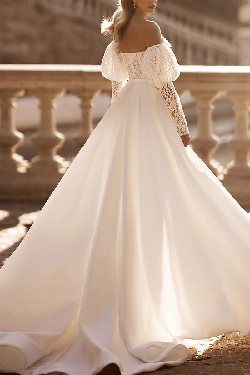 Back view of a lace wedding dress with long sleeves.